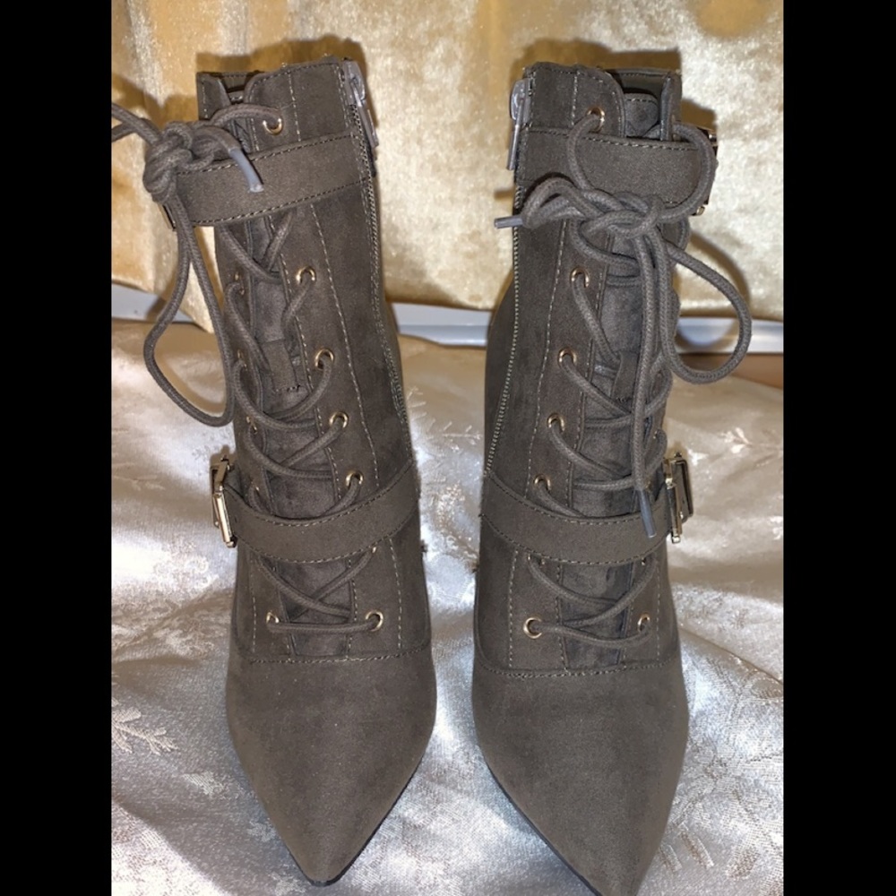 Olive green laced up high heeled booties